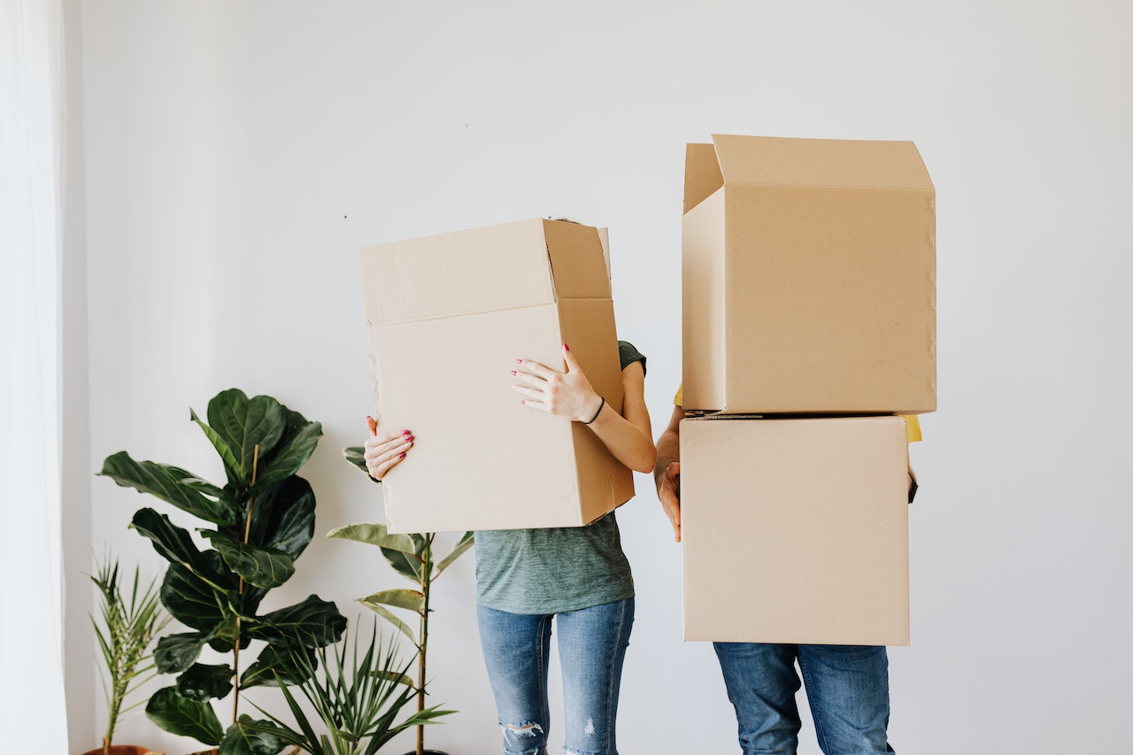 People holding boxes for moving